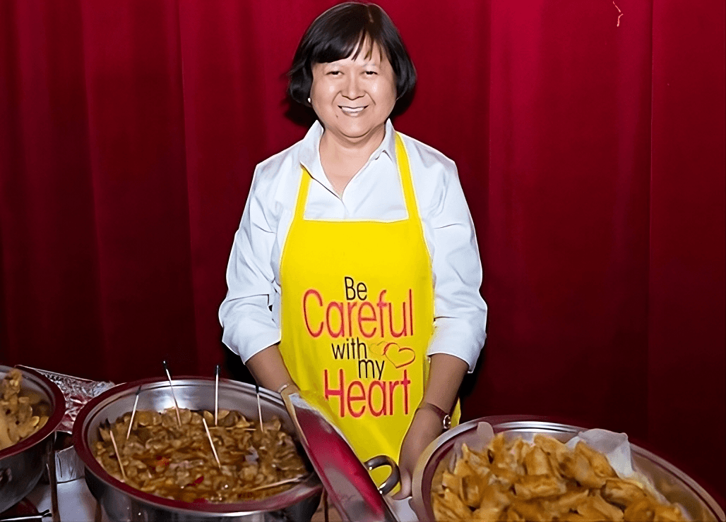 Lola cooking in her yellow apron